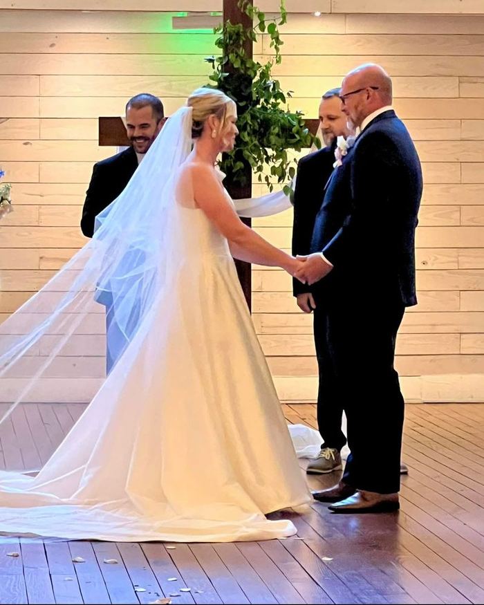 Bride in a fitted wedding gown