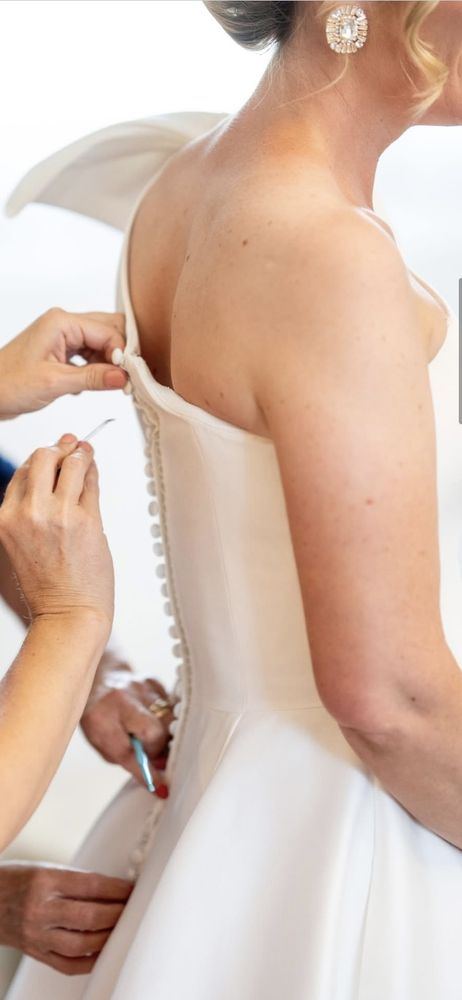 Back of a buttoned wedding gown