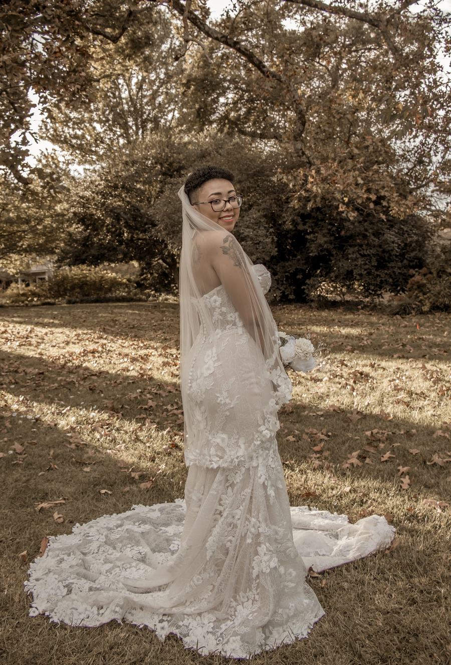 A lace wedding gown with a long train
